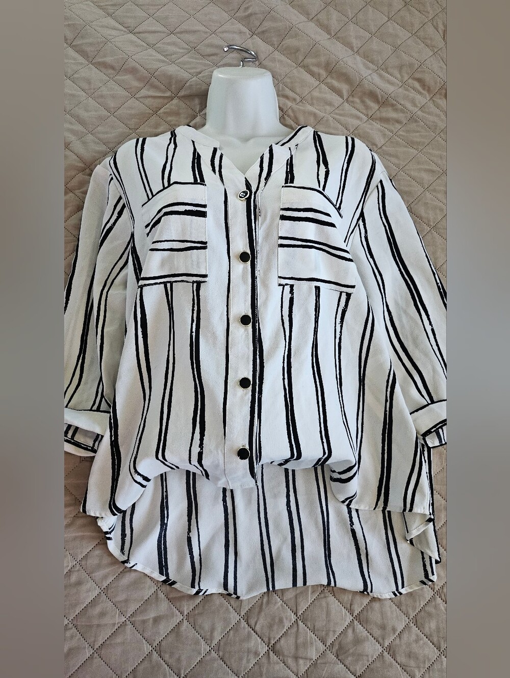 Women's size medium blouse white with black stripes. Used in good condition